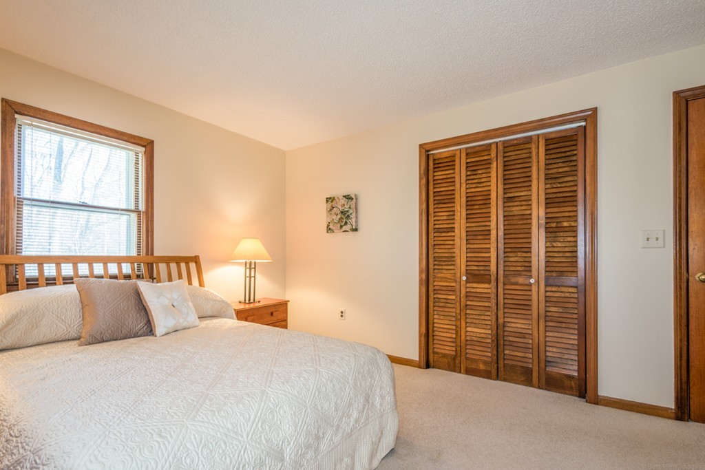 208 Boxboro Road Stow, MA 01775 - Photo 16 of 27 a bedroom with a bed and a window