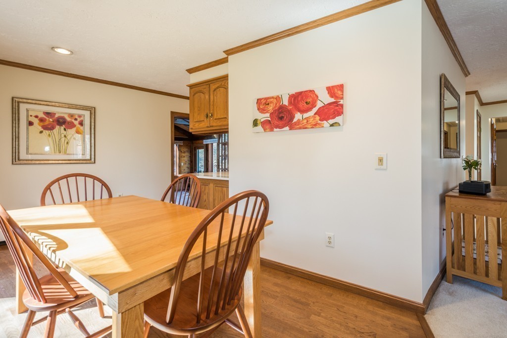 208 Boxboro Road Stow, MA 01775 - Photo 6 of 27 a view of a dining room with furniture and wooden floor