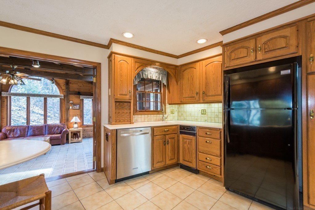 208 Boxboro Road Stow, MA 01775 - Photo 8 of 27 a kitchen with stainless steel appliances granite countertop a refrigerator and a stove top oven
