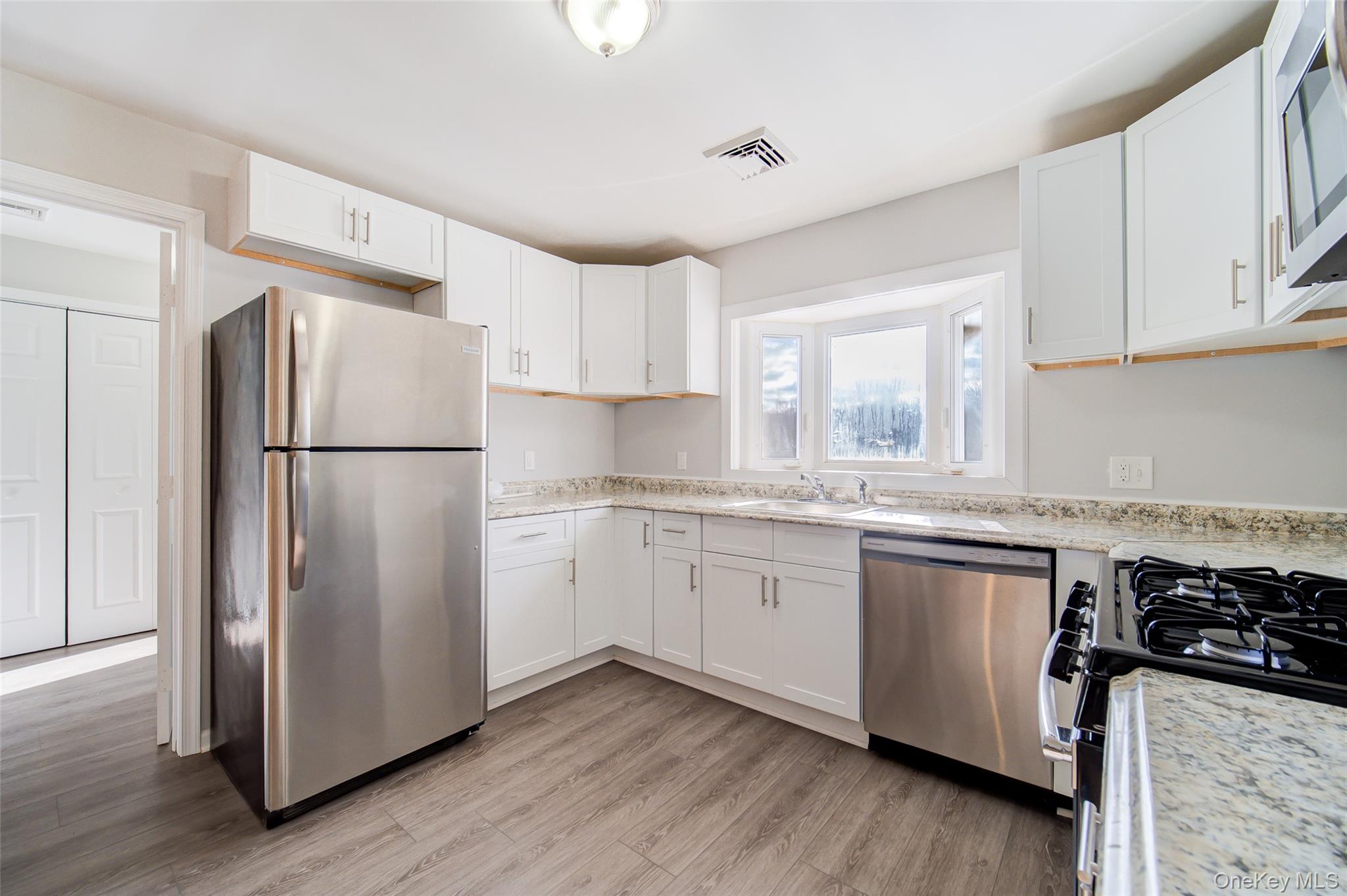 2213 Mt Hope Road, Unit A Middletown, NY 10940 - Photo 13 of 21 a kitchen with granite countertop a refrigerator sink and cabinets