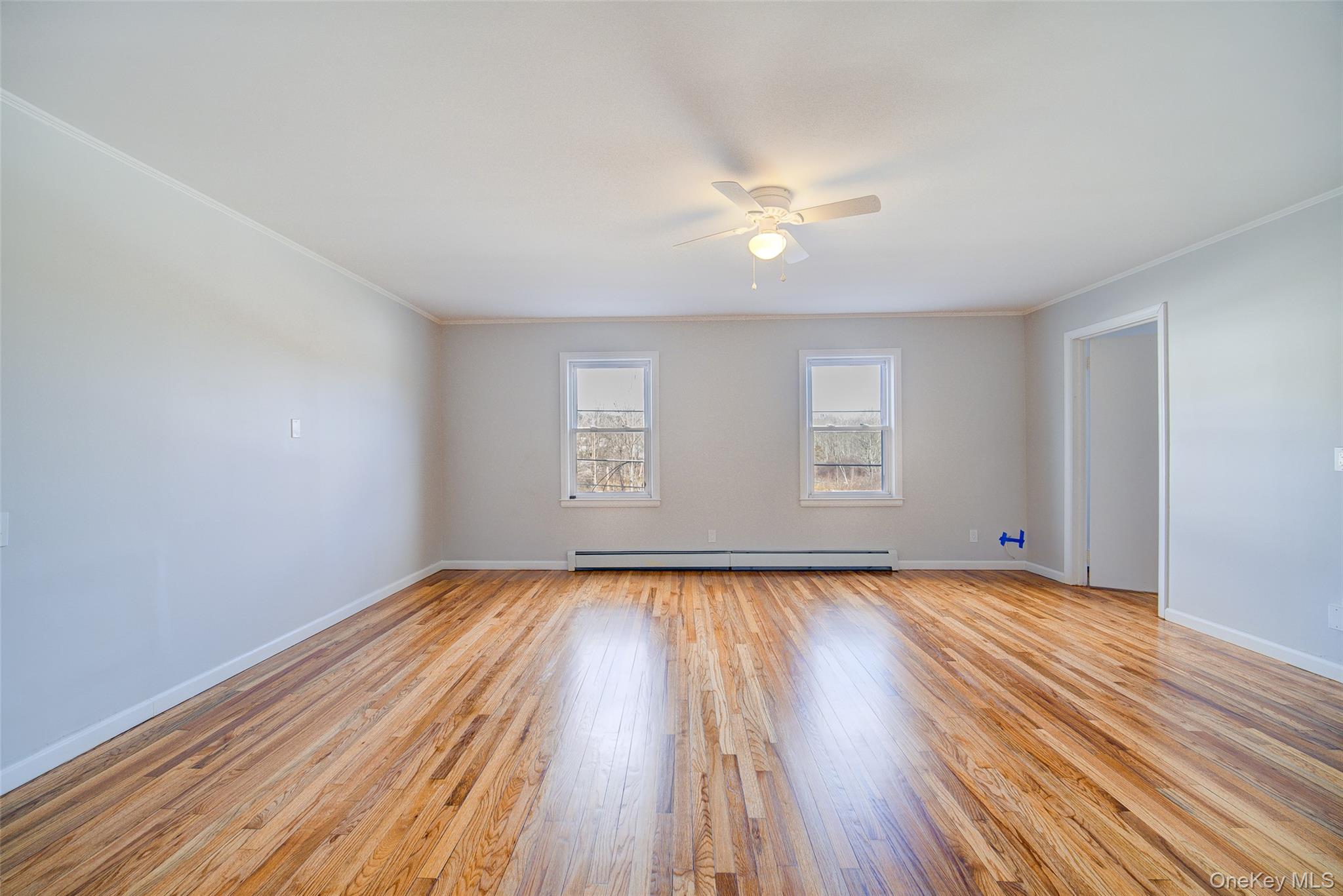 2213 Mt Hope Road, Unit A Middletown, NY 10940 - Photo 7 of 21 a view of an empty room with wooden floor and a window
