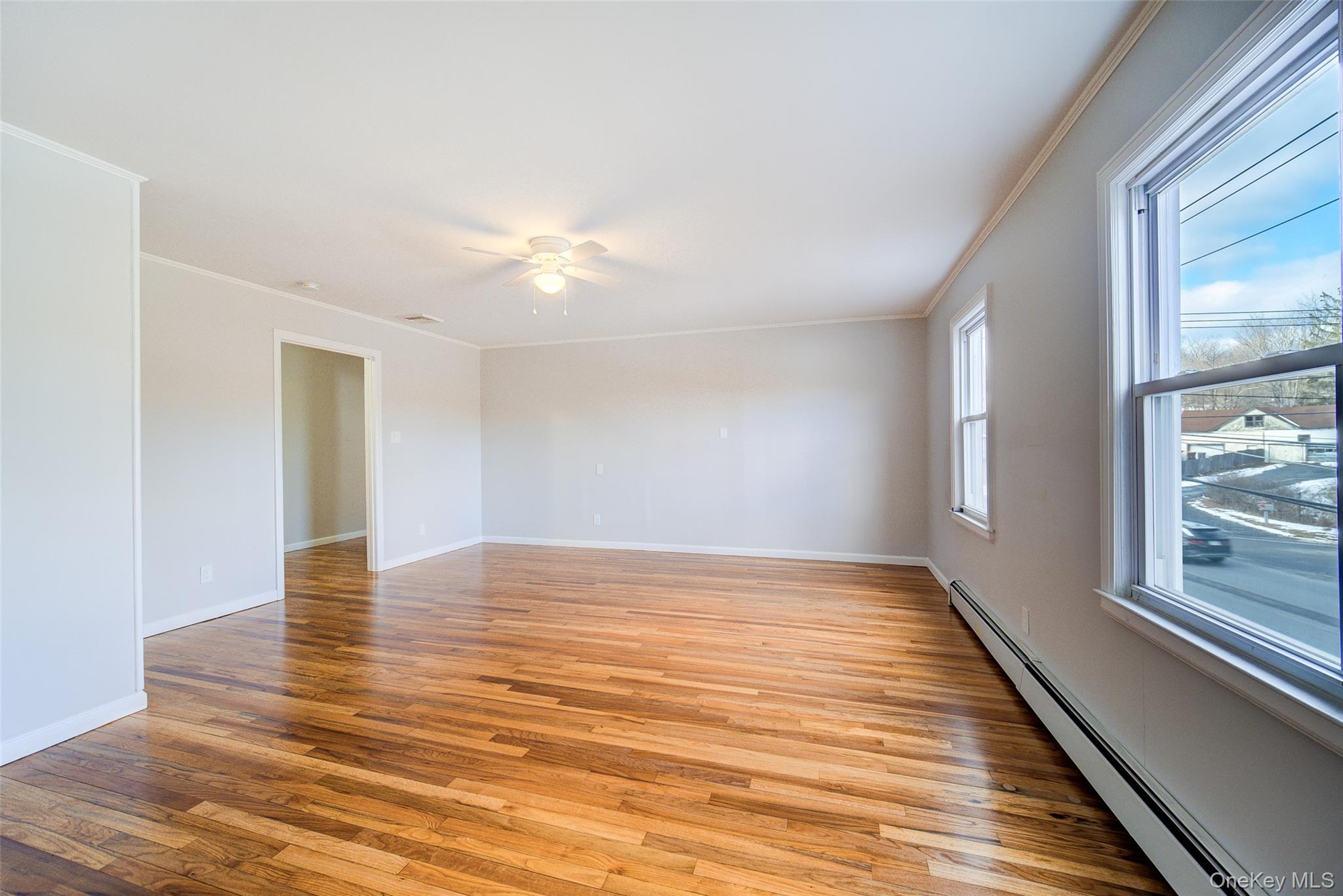 2213 Mt Hope Road, Unit A Middletown, NY 10940 - Photo 9 of 21 a view of empty room with wooden floor and fan