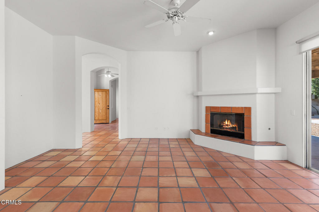 67 Tempe Trail Palm Desert, CA 92211 - Photo 12 of 56 a view of an empty room with a fireplace