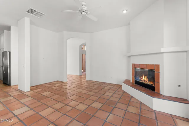 a bedroom with a bed and a fireplace