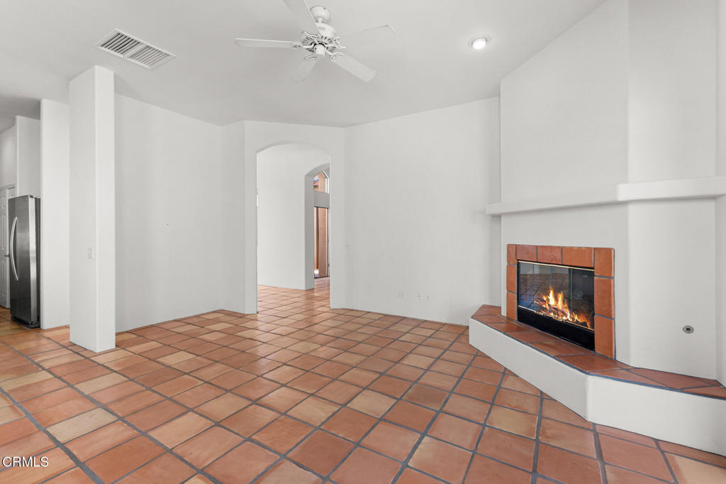 67 Tempe Trail Palm Desert, CA 92211 - Photo 13 of 56 a bedroom with a bed and a fireplace