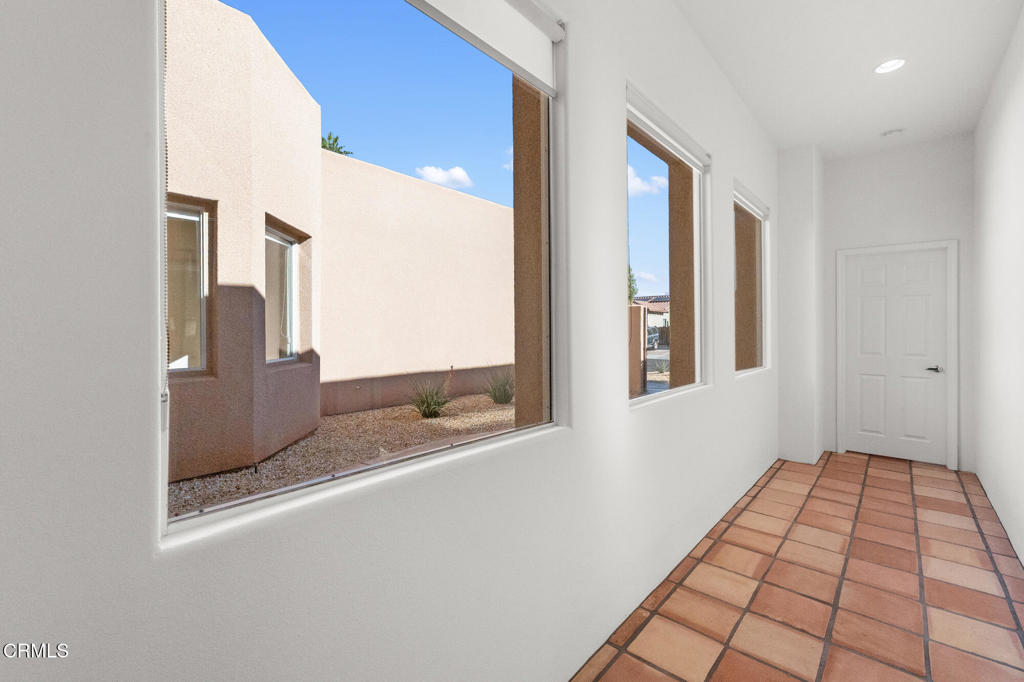 67 Tempe Trail Palm Desert, CA 92211 - Photo 23 of 56 a view of a hallway with a window
