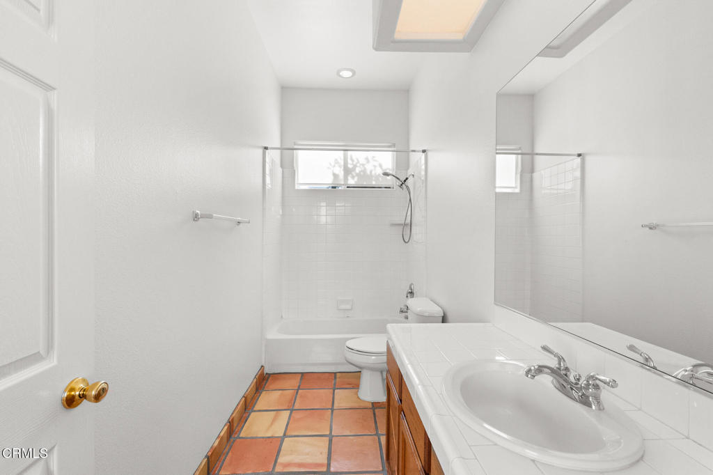 67 Tempe Trail Palm Desert, CA 92211 - Photo 29 of 56 a bathroom with a sink and a mirror