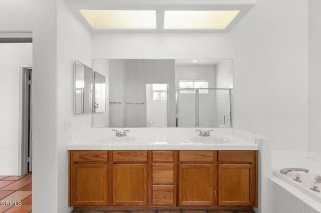a bathroom with a bathtub and a shower