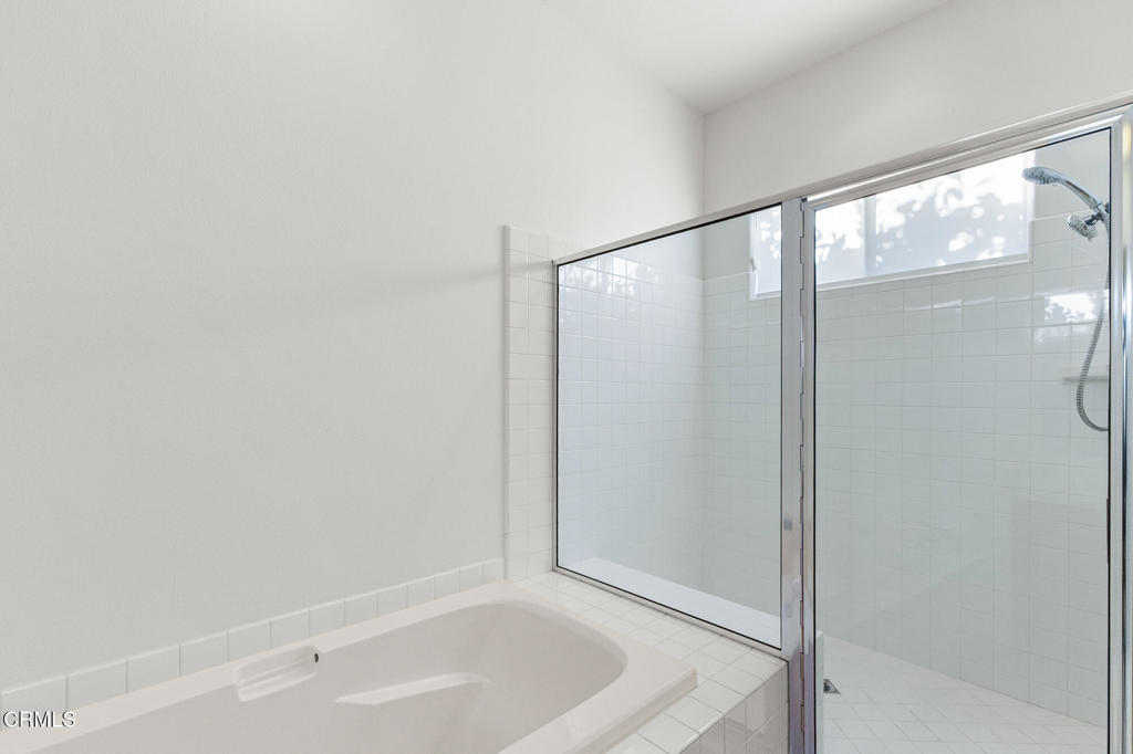 67 Tempe Trail Palm Desert, CA 92211 - Photo 37 of 56 a bathroom with a bathtub and a shower