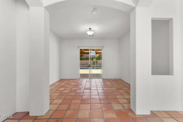 a view of an empty room and window