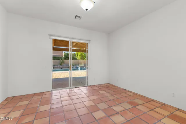 a view of an empty room and window