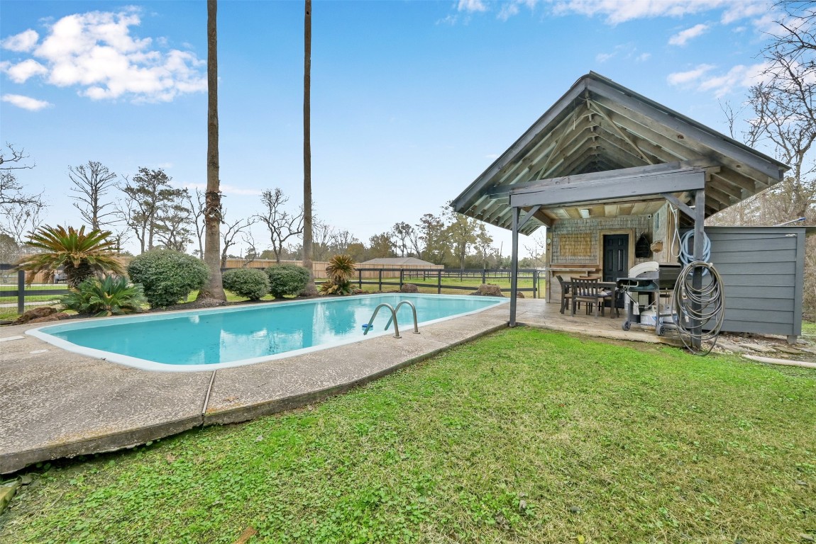 22603 Tuwa Road Tomball, TX 77375 - Photo 1 of 39 a view of a house with swimming pool and sitting area
