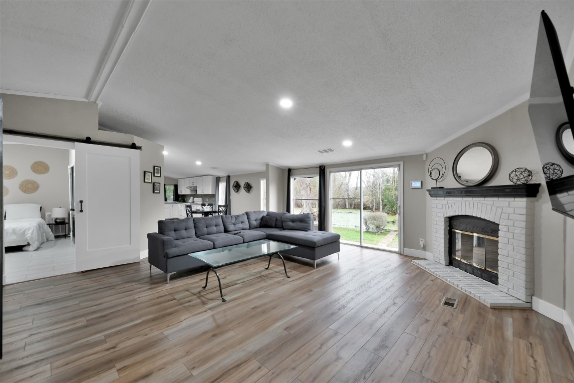22603 Tuwa Road Tomball, TX 77375 - Photo 11 of 39 a living room with furniture and a fireplace