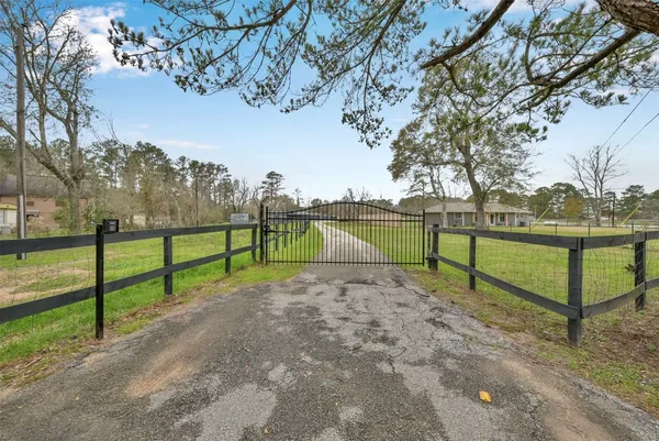 a view of park with wooden fence