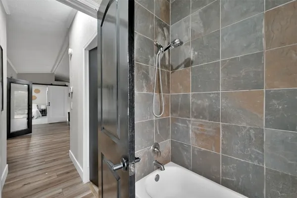 a bathroom with a shower and a toilet