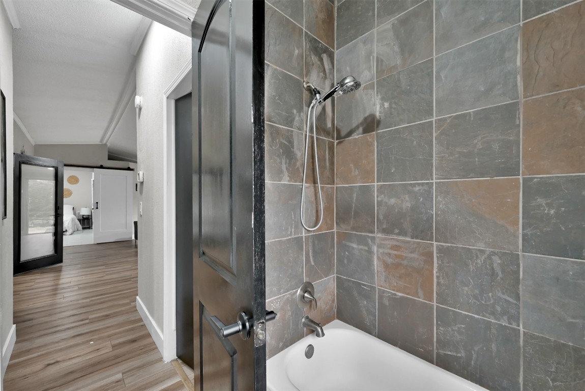 22603 Tuwa Road Tomball, TX 77375 - Photo 23 of 39 a bathroom with a shower and a toilet