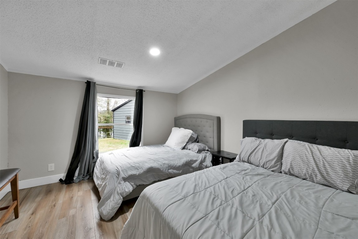 22603 Tuwa Road Tomball, TX 77375 - Photo 24 of 39 a bedroom with two beds and a window