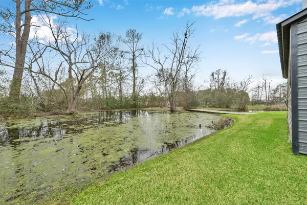 a view of lake with a yard