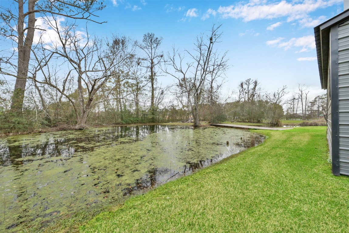 22603 Tuwa Road Tomball, TX 77375 - Photo 33 of 39 a view of lake with a yard