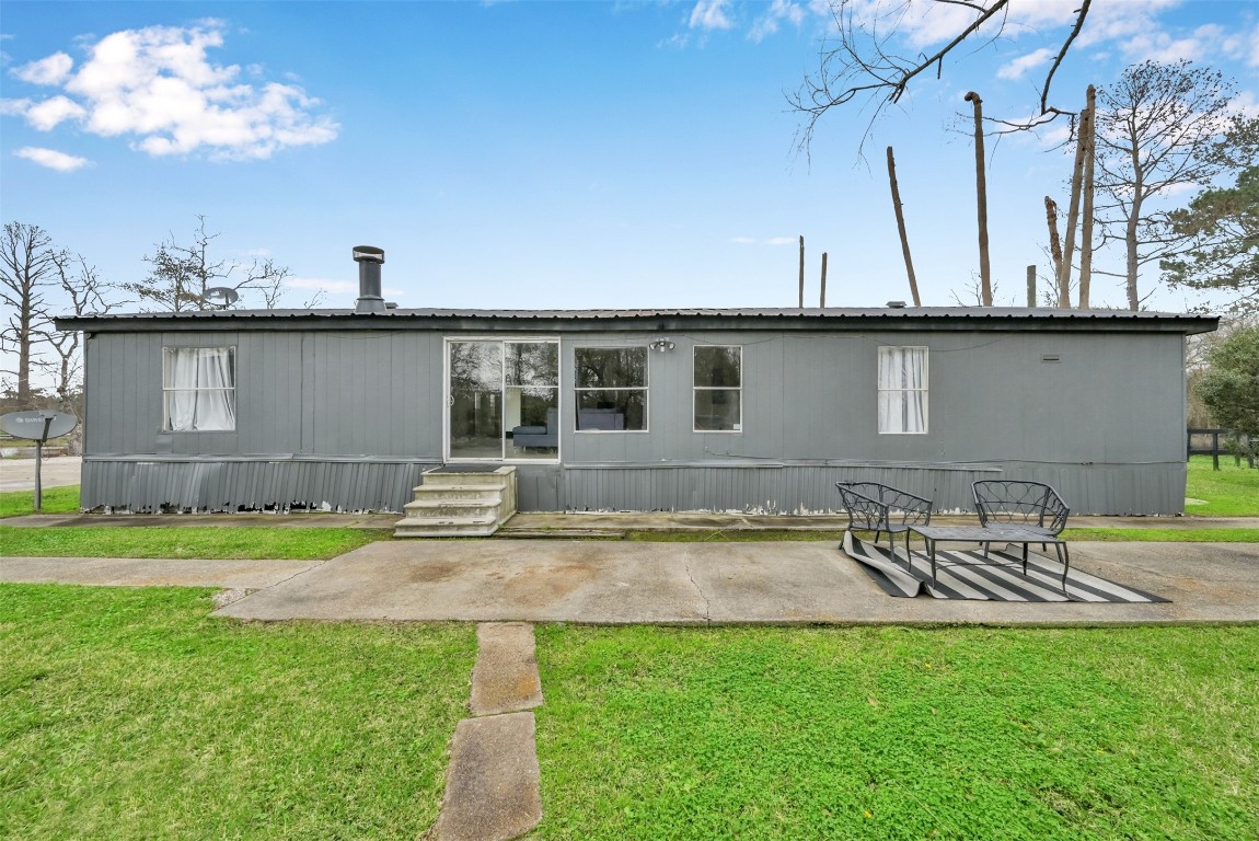 22603 Tuwa Road Tomball, TX 77375 - Photo 34 of 39 a view of a house with backyard and sitting area