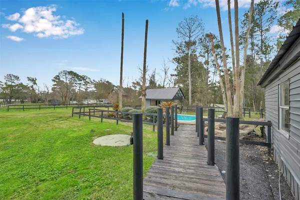 a view of a deck with a big yard