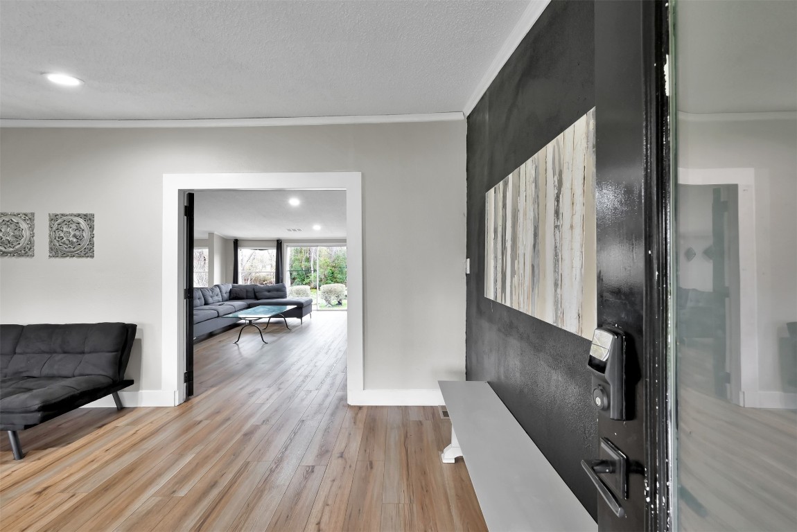 22603 Tuwa Road Tomball, TX 77375 - Photo 7 of 39 a view of a living room and dining room with wooden floor