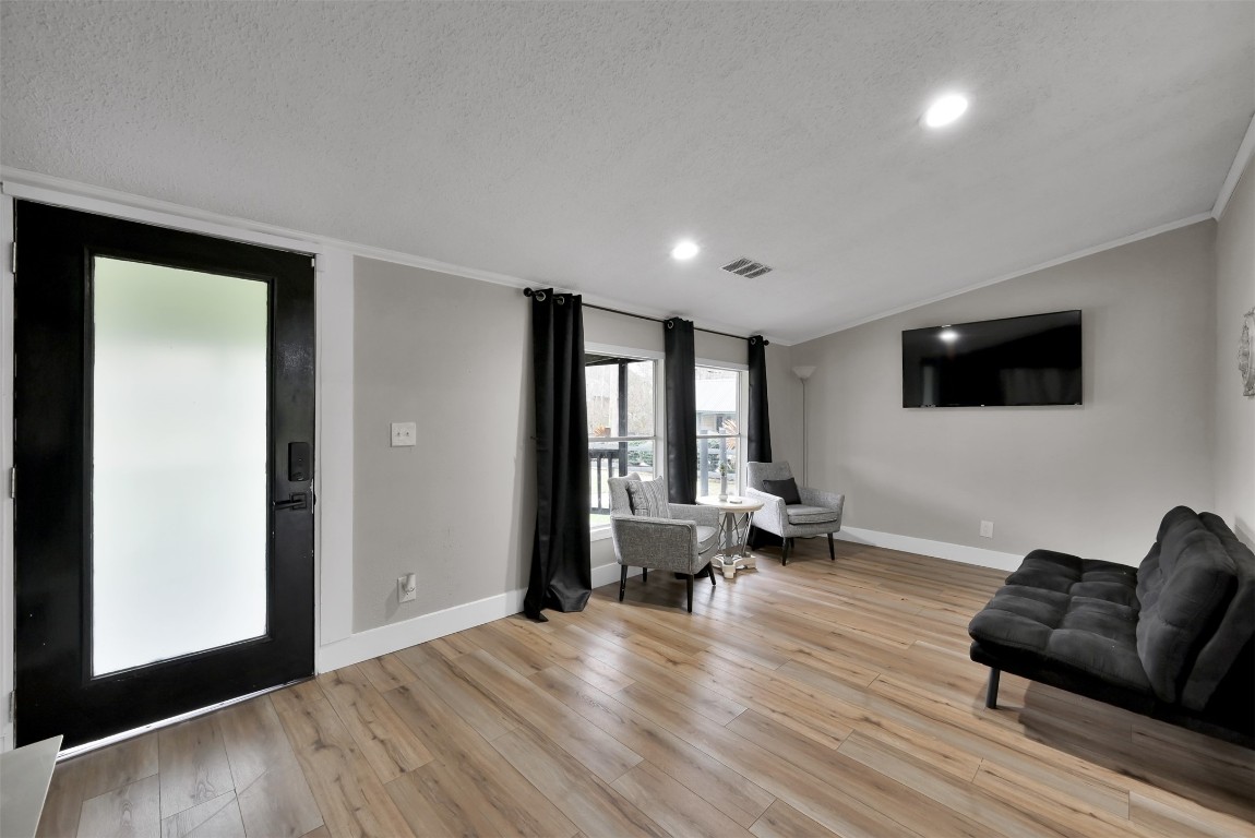 22603 Tuwa Road Tomball, TX 77375 - Photo 9 of 39 a living room with furniture and a flat screen tv
