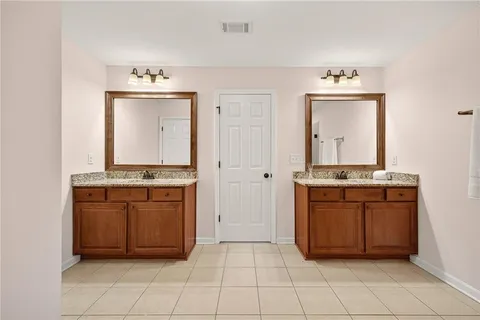 a room with kitchen island cabinets and fireplace