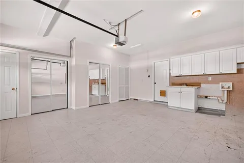 a view of swimming pool with sitting area and garden