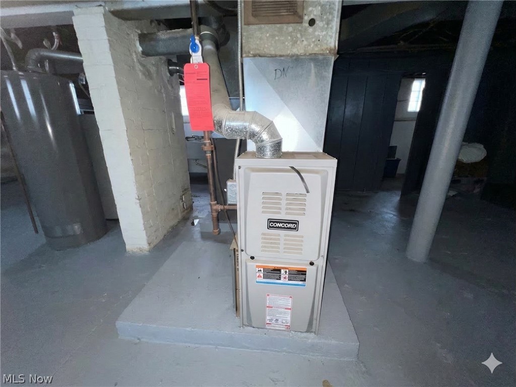 10112 Aetna Road Cleveland, OH 44105 - Photo 28 of 31 Utility room featuring water heater and heating unit