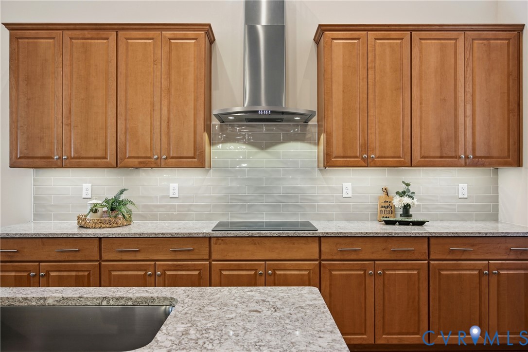 6101 Courage Trail Chester, VA 23831 - Photo 18 of 50 a kitchen with stainless steel appliances granite countertop wooden cabinets and sink