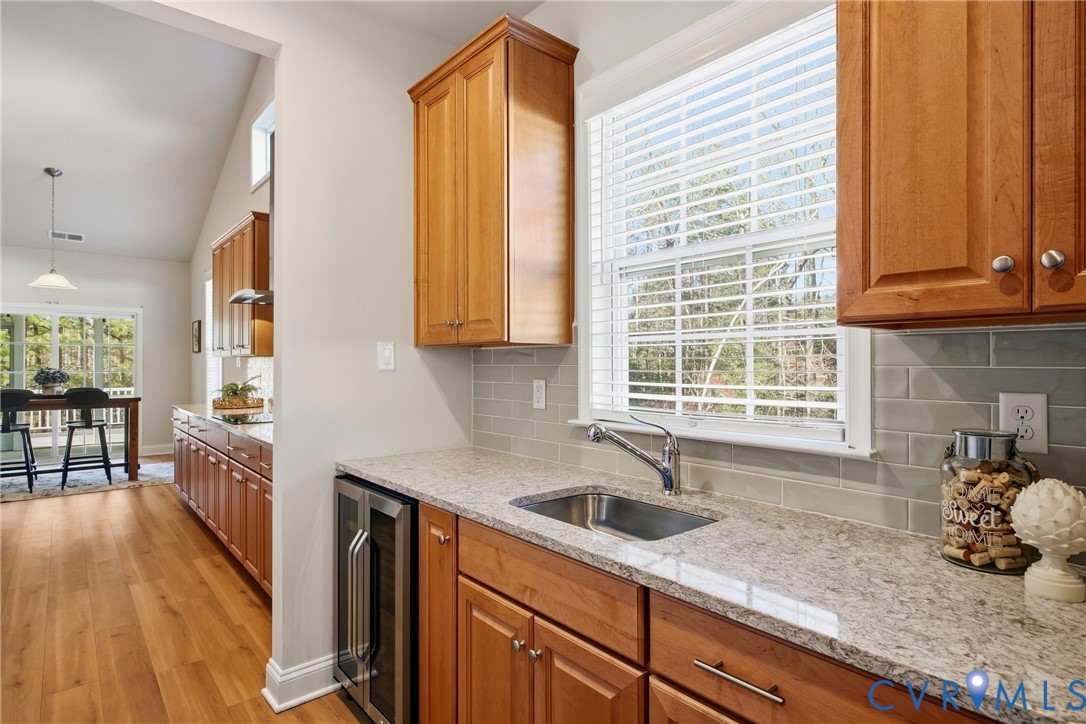 6101 Courage Trail Chester, VA 23831 - Photo 21 of 50 a kitchen with granite countertop a sink and a window