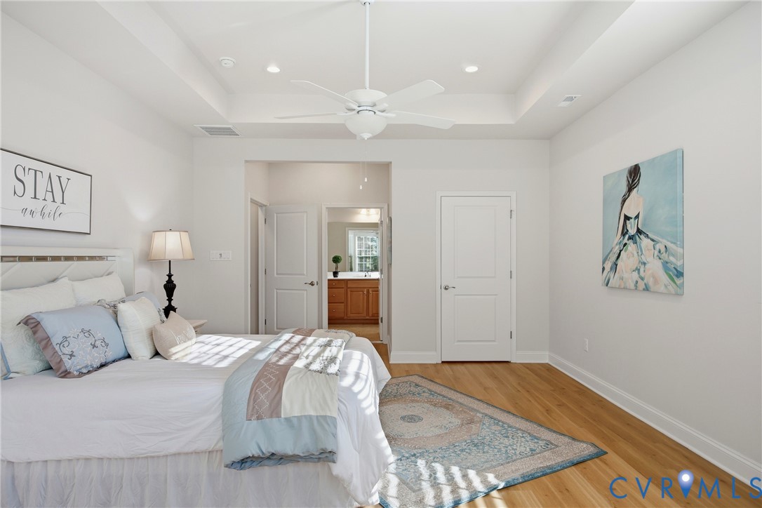 6101 Courage Trail Chester, VA 23831 - Photo 24 of 50 a bedroom with a bed and a painting on the wall