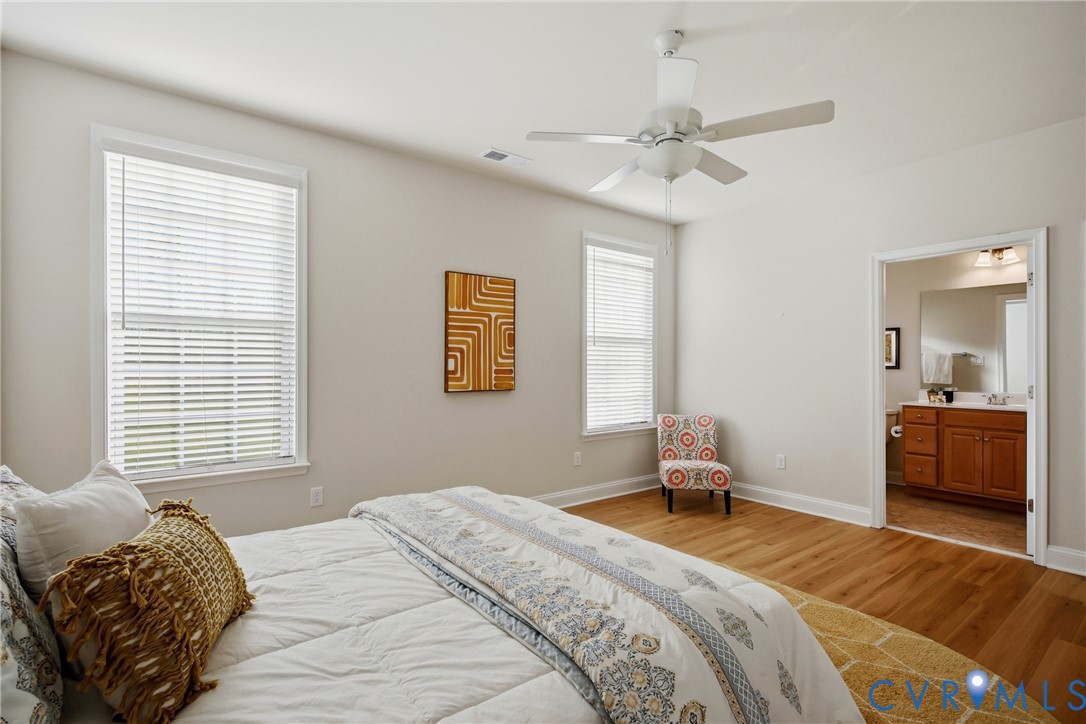 6101 Courage Trail Chester, VA 23831 - Photo 28 of 50 a bedroom with a bed and a chandelier
