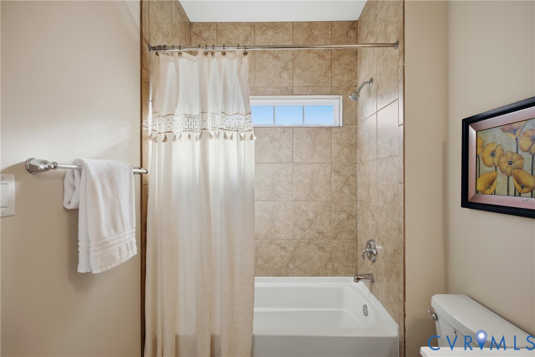 6101 Courage Trail Chester, VA 23831 - Photo 29 of 50 a bathroom with a shower and a tub