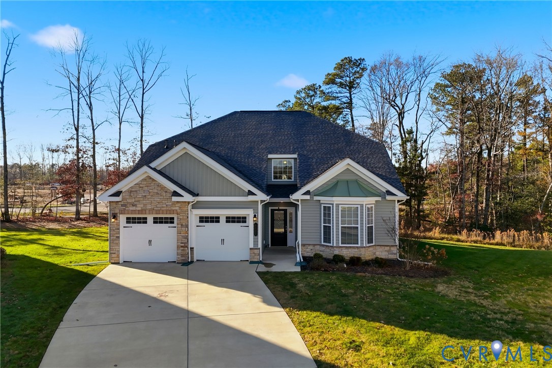 6101 Courage Trail Chester, VA 23831 - Photo 47 of 50 a front view of a house with a garden and trees