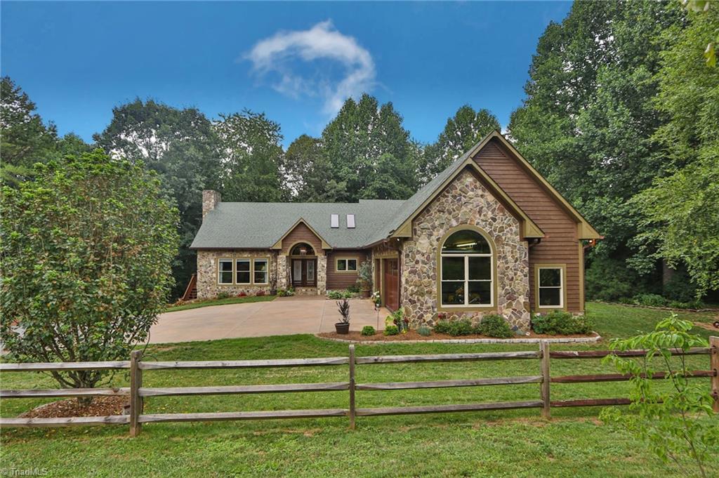 10901 Austin Traphill Road Traphill, NC 28685 - Photo 2 of 50 Stately home privately nestled on 26 acres of lush pasture and woods sits a stately stone and cedar home