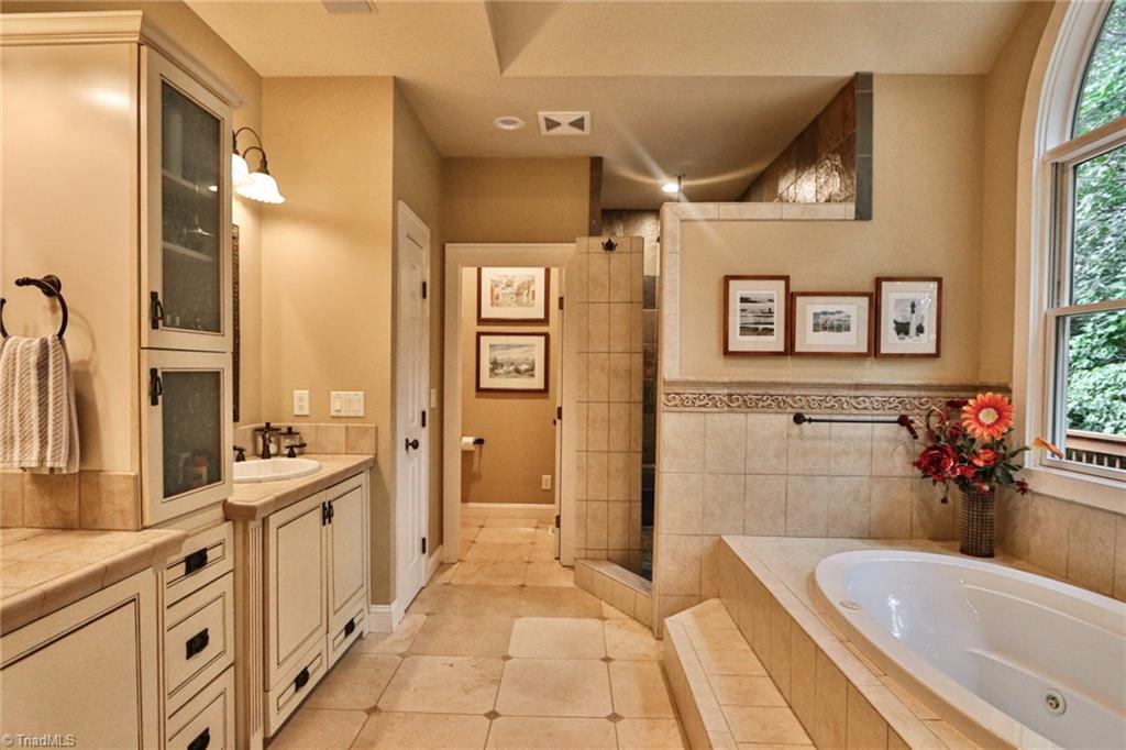 10901 Austin Traphill Road Traphill, NC 28685 - Photo 24 of 50 Owner's luxurious bath with Travertine floor honed and unfilled