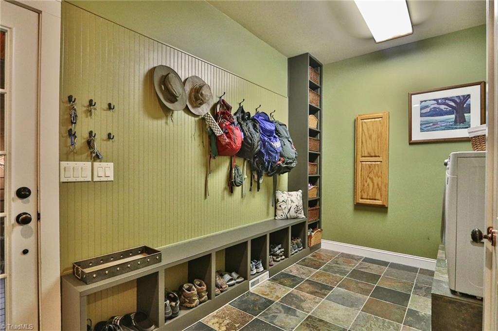 10901 Austin Traphill Road Traphill, NC 28685 - Photo 30 of 50 Custom storage in laundry room with slate floors.