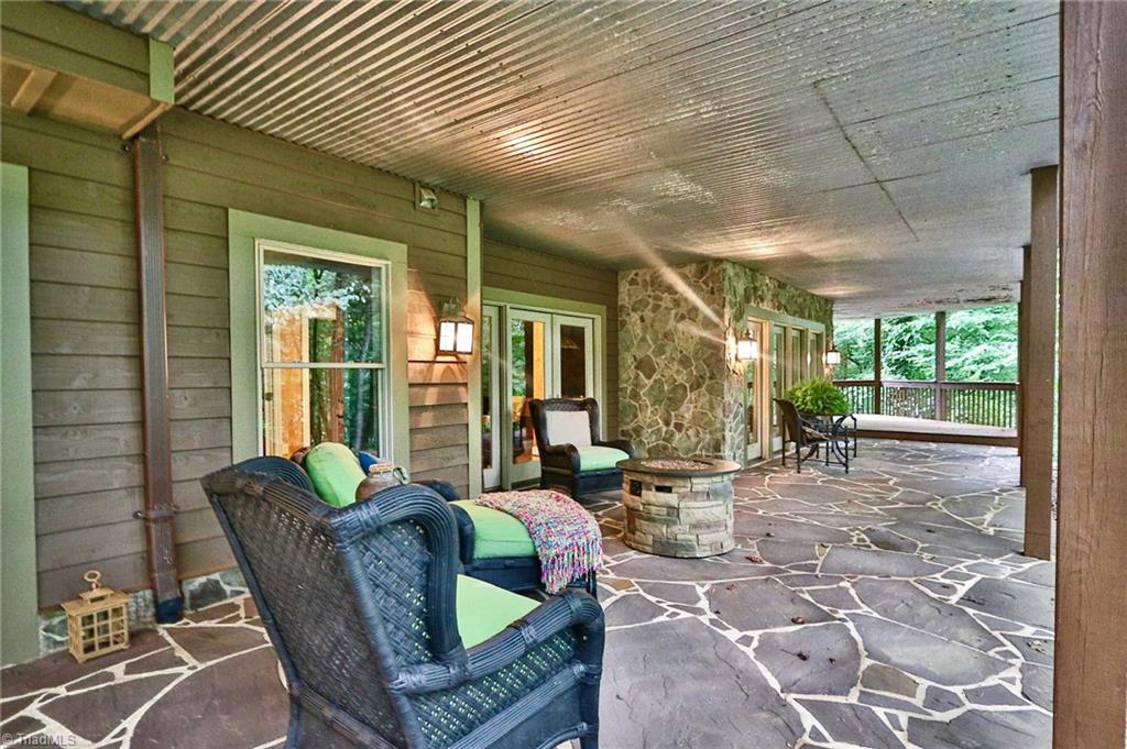 10901 Austin Traphill Road Traphill, NC 28685 - Photo 44 of 50 Lounge in nature on the downstairs cozy covered porch watching nature or listening to the rain