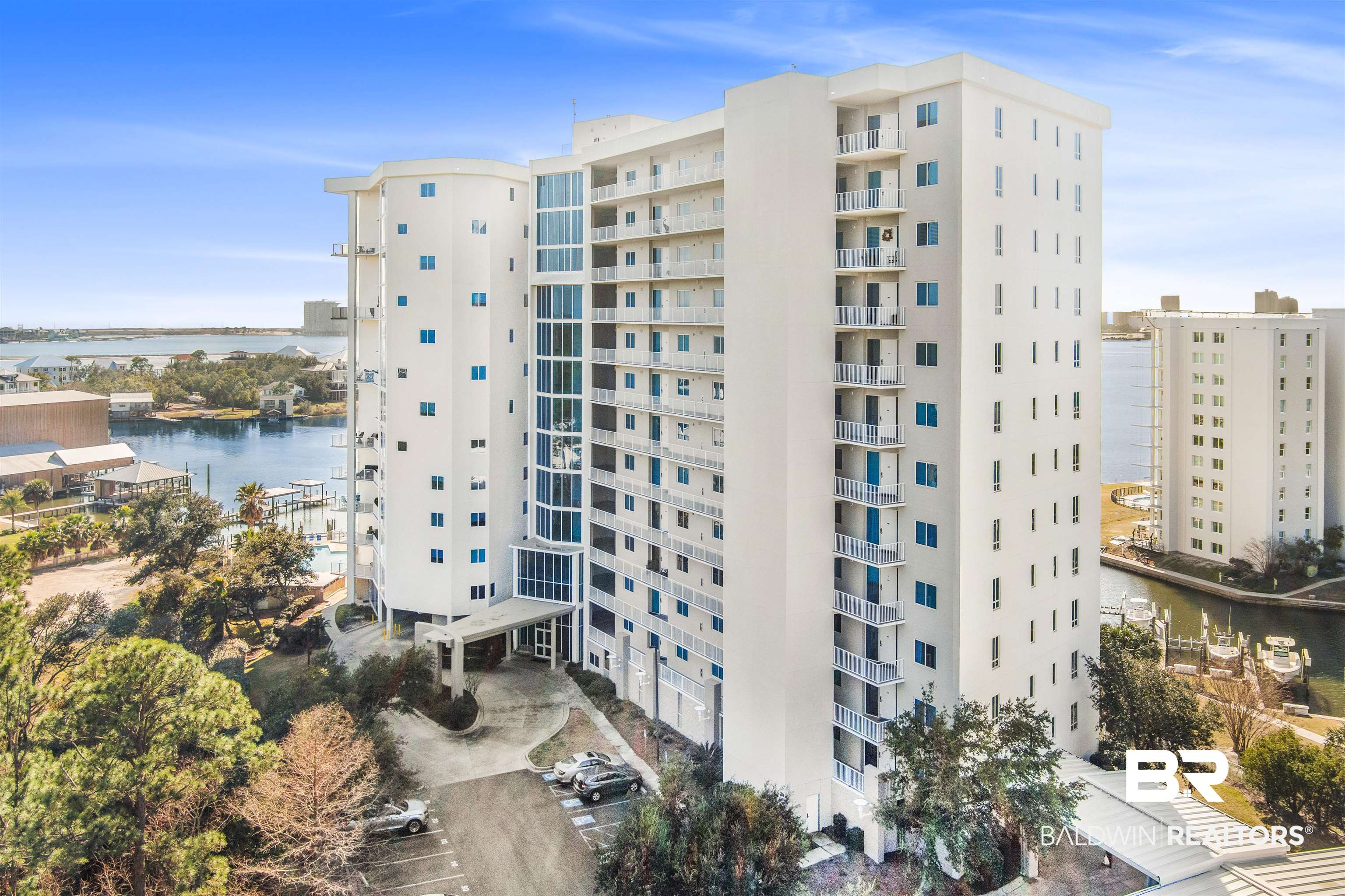 28250 Canal Road, Unit 106 Orange Beach, AL 36561 - Photo 1 of 50 View of apartment building / complex featuring a water view