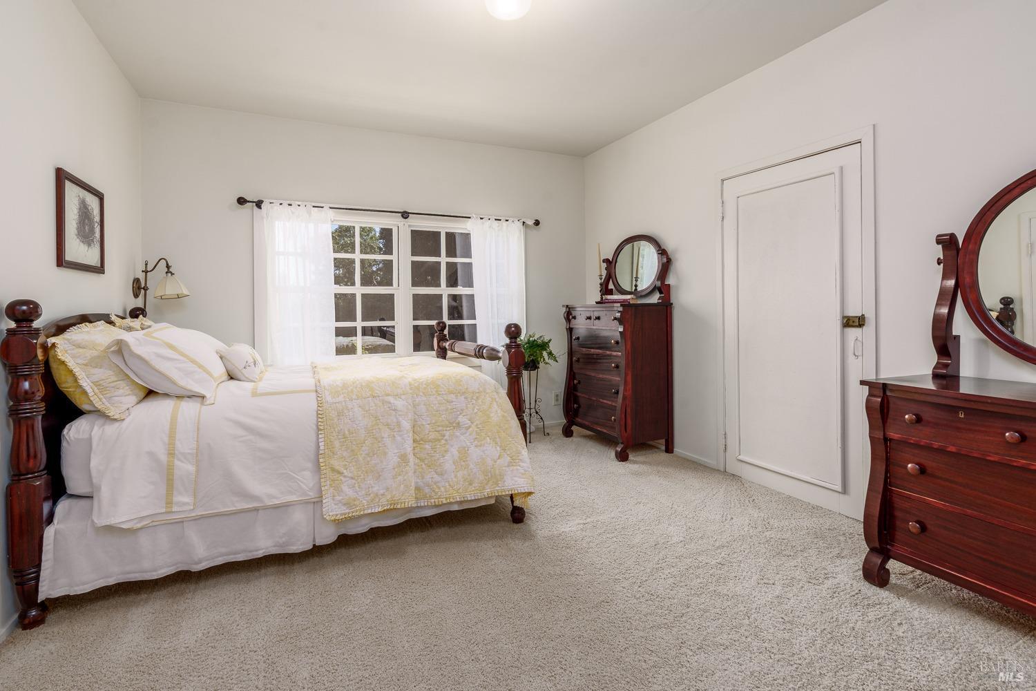5700 Old River Road Ukiah, CA 95482 - Photo 26 of 56 a spacious bedroom with a bed and a dresser