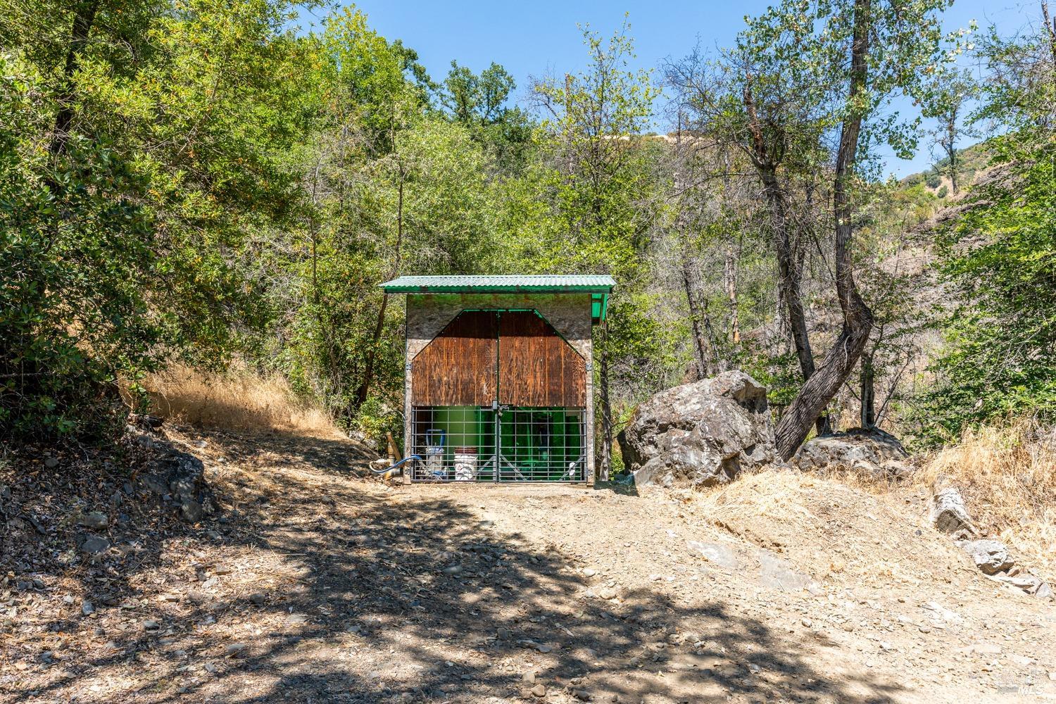 5700 Old River Road Ukiah, CA 95482 - Photo 54 of 56 a pathway of a house with a yard