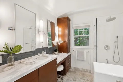 a bathroom with a sink a vanity and a mirror