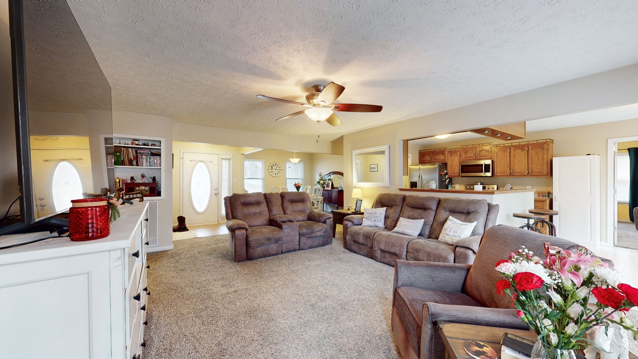 152 Shawna Street McMinnville, TN 37110 - Photo 3 of 22 a living room with furniture kitchen view and a chandelier