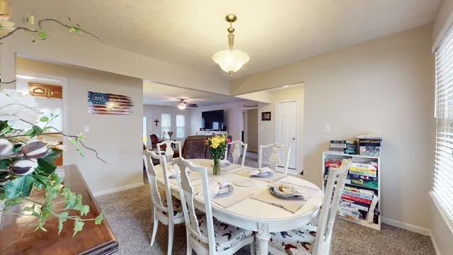 a view of a dining room with furniture