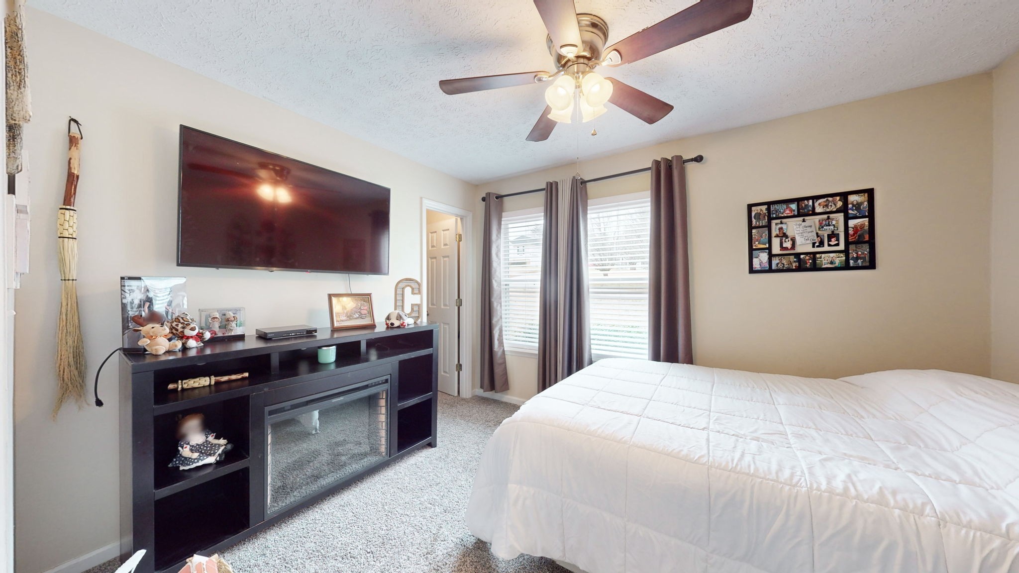 152 Shawna Street McMinnville, TN 37110 - Photo 8 of 22 a bedroom with a bed and a flat screen tv