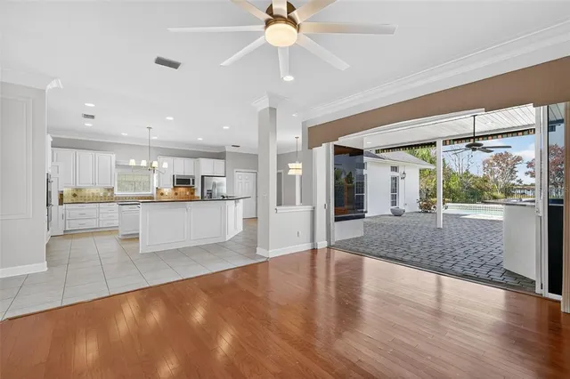 a kitchen with stainless steel appliances granite countertop a sink a counter top space and cabinets