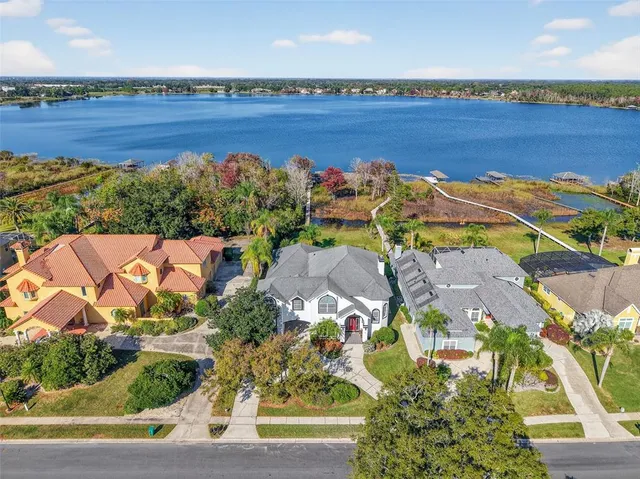 an aerial view of a house with a ocean view