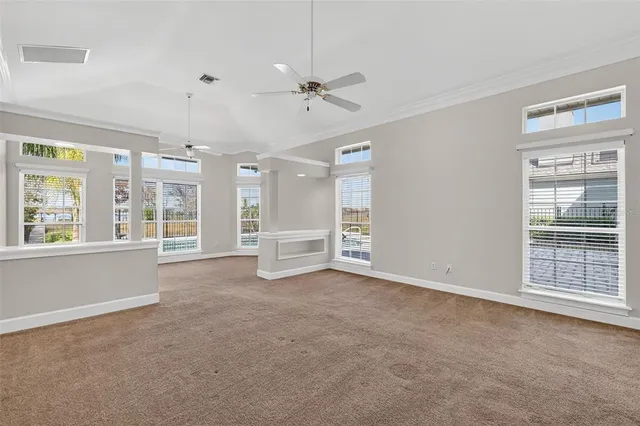 a bathroom with a granite countertop toilet sink and mirror